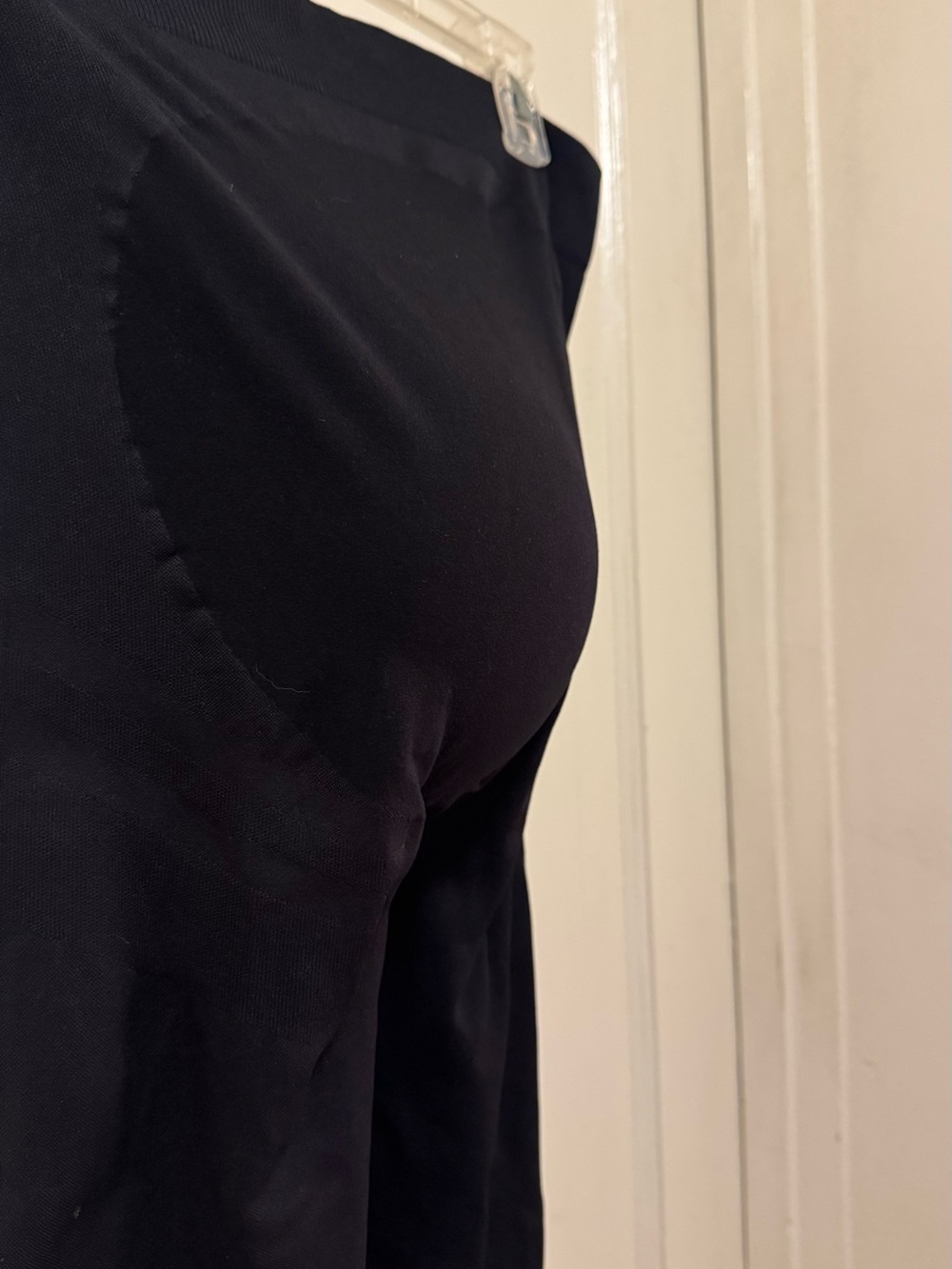 Maternity leggings with built-in baby pouch.